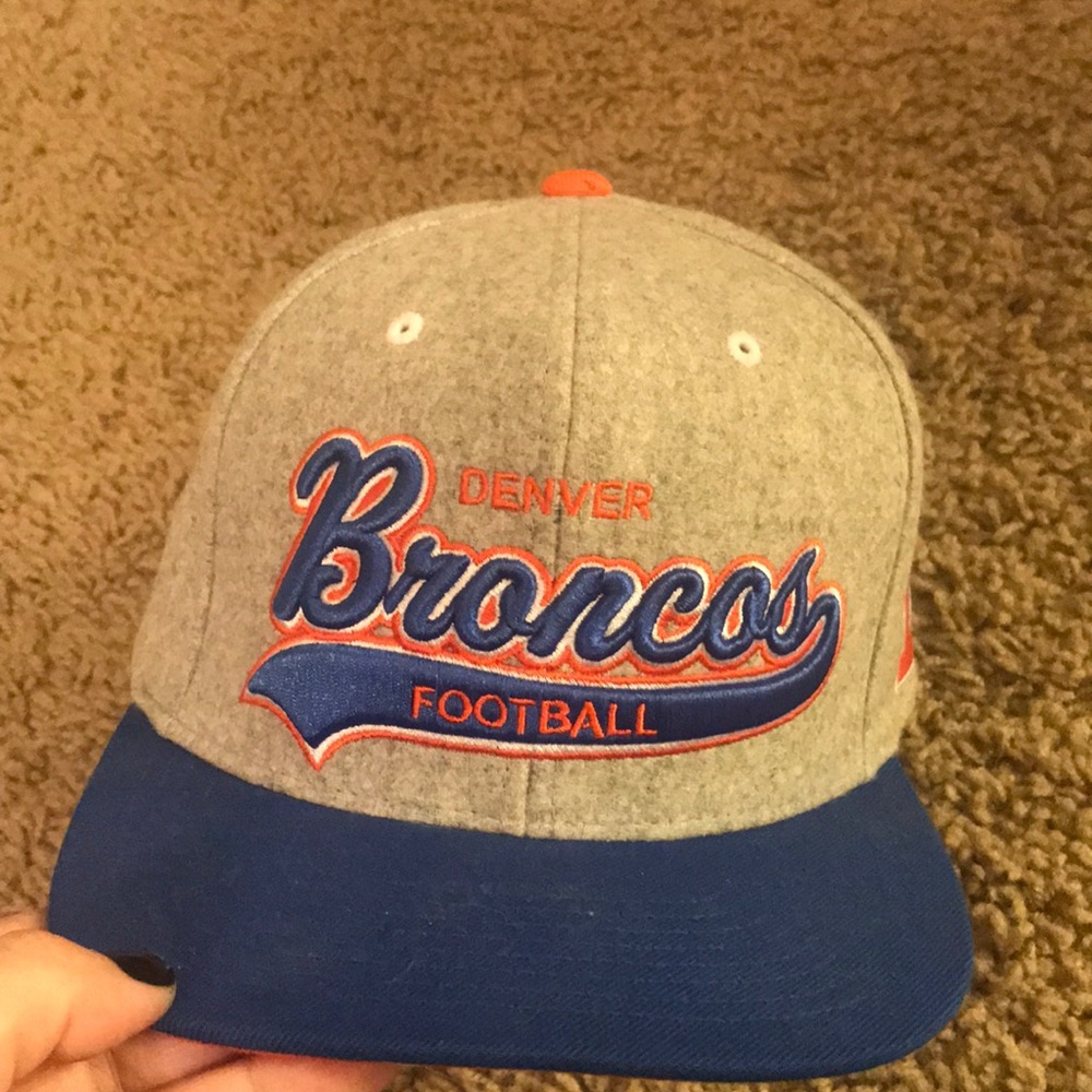 Gray Broncos hat.
